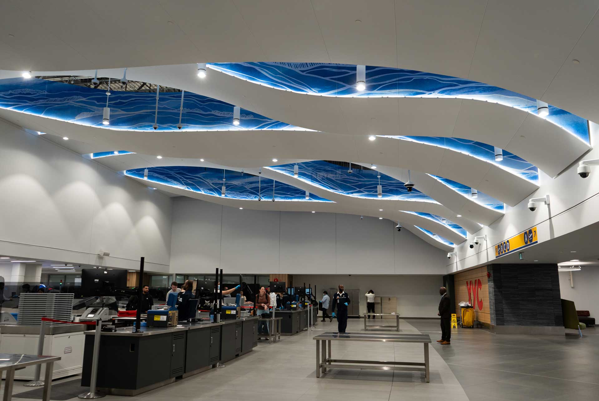 Custom Cloud System with blue illustrations on sides installed to ceiling